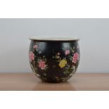 A turn of the century English ceramic planter, black floral 'chinoiserie' glaze, marked indistinctly