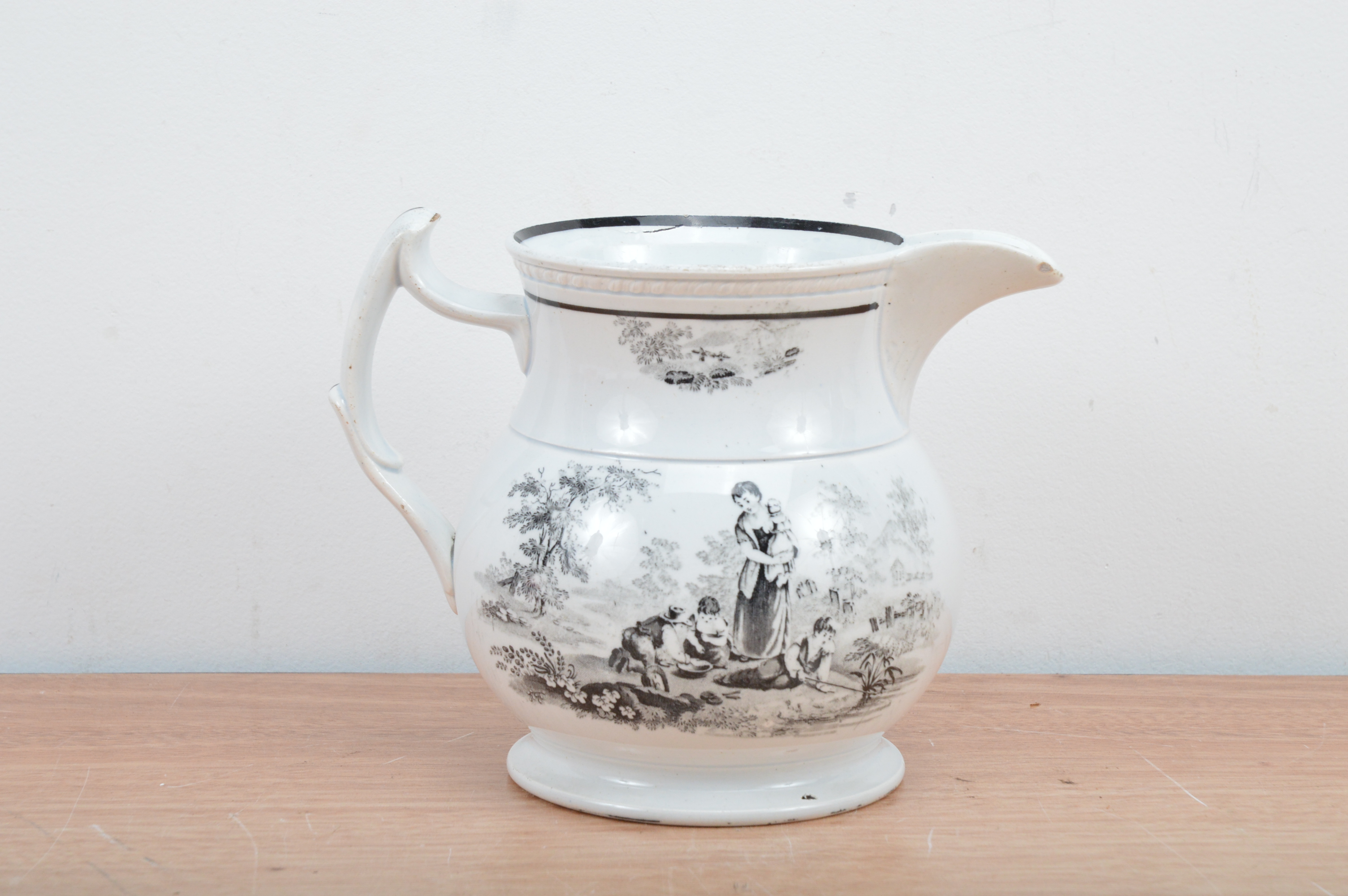 A 19th century English transfer printed pearlware jug, black transfer ...