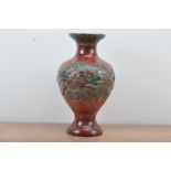 A collection of West German Pottery, comprising, a green and red glazed example, raised design of