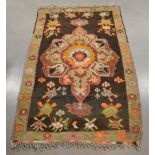 A middle-eastern multi coloured rug, geometric design, cotton fringes, some minor wear, 249cm x