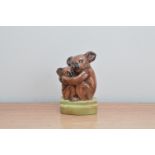 An early 20th century pottery figurine of a Koala bear and its cub, by Goldscheider, marked to the