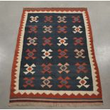 A modern kilim rug, geometric design, fringes, 185cm x 128cm