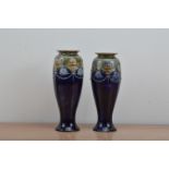 A pair of Royal Doulton salt-glazed stoneware vases, blue and green glaze with raised swags, both