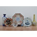 A collection of Chinese and Japanese ceramic items, comprising a vase with a blue glaze and panels