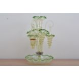 A turn of the century glass epergne, opalescent base with green glass shaped rim, a central