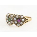 A contemporary 9ct ruby, emerald and seed pearl double heart ring, round cut emeralds and rubies