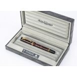 A modern Parker Duofold fountain pen, the International model pen with maroon mottled barrel and cap
