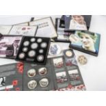 A collection of commemorative coins and stamps, including a small collection of modern Princess