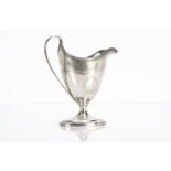 A George III Scottish silver jug by W & P Cunningham, engraved design to helmet shaped well with