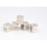 A set of five silver cubes, bearing hallmarks and impressed hearts, one face vacant, 94g