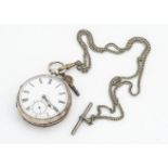 A Victorian silver open faced pocket watch, 50mm case, appears to run, on a chain marked Mexican
