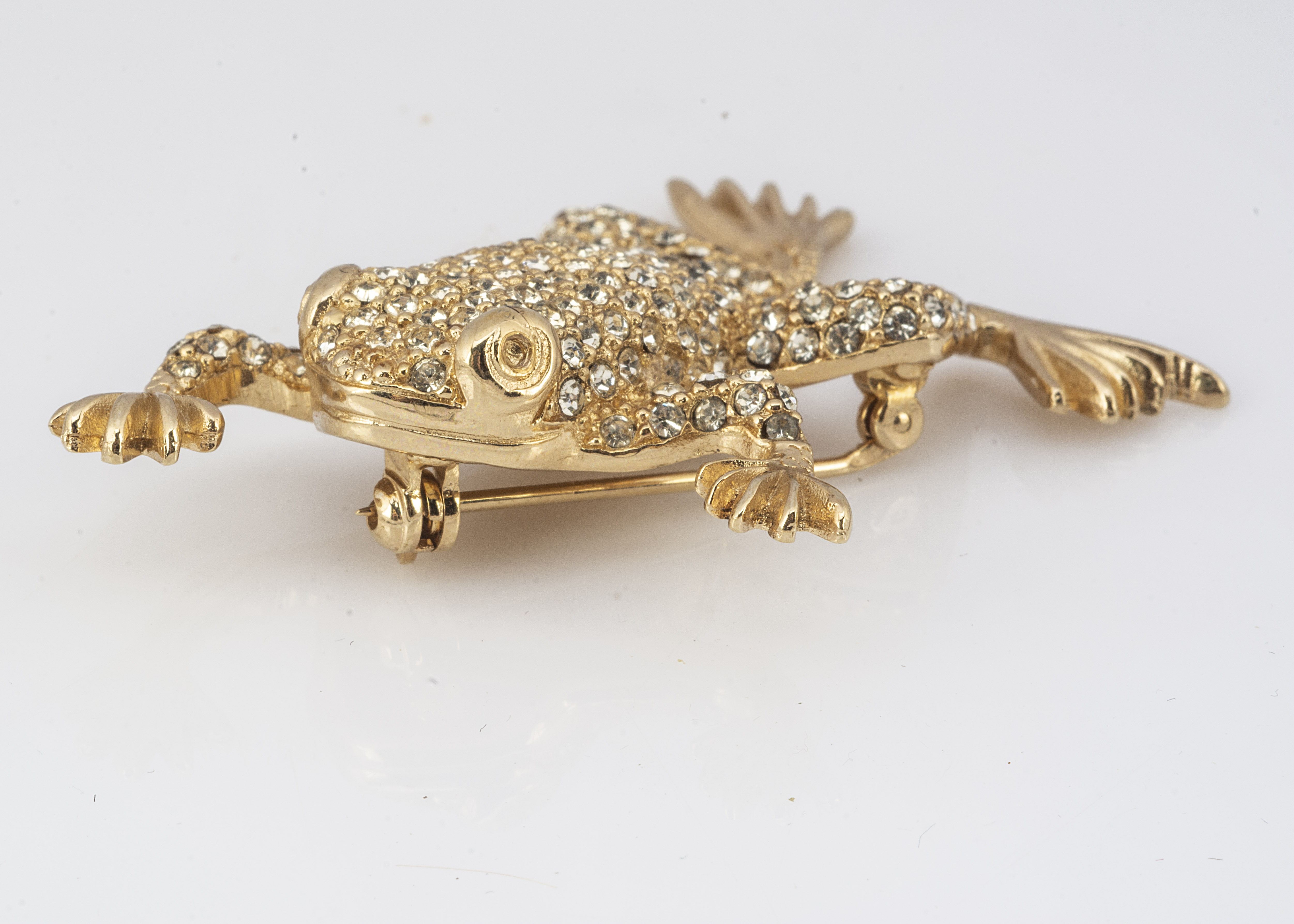 A Christian Dior frog brooch, encrusted with paste set gems, having pin back, 5cm x 3.5cm, 12.4g - Image 2 of 3