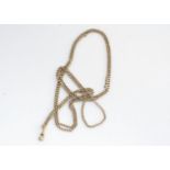A late 19th century early 20th century 9c muff chain, belcher links, marked 9c to clasp, 75 cm, 21g