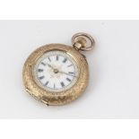 A 14k gold open faced ladies fob watch, white enamel dial with Roman Numerals, in an ornate mount,