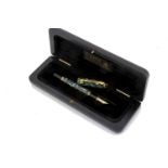 A modern Parker Duofold fountain pen, with green marbled barrel and cap, 18ct gold nib, unused, with