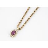 An 18ct gold ruby and diamond oval drop pendant, on a 9ct gold rope twist chain, 24cm together, 9.8g