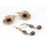 Two pairs of earrings, including a pair of 14ct gold ruby oval examples, 2.7cm x 1.5cm, together