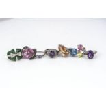 Seven silver and gem set dress rings, of various styles, including bow, cluster, pear and others,