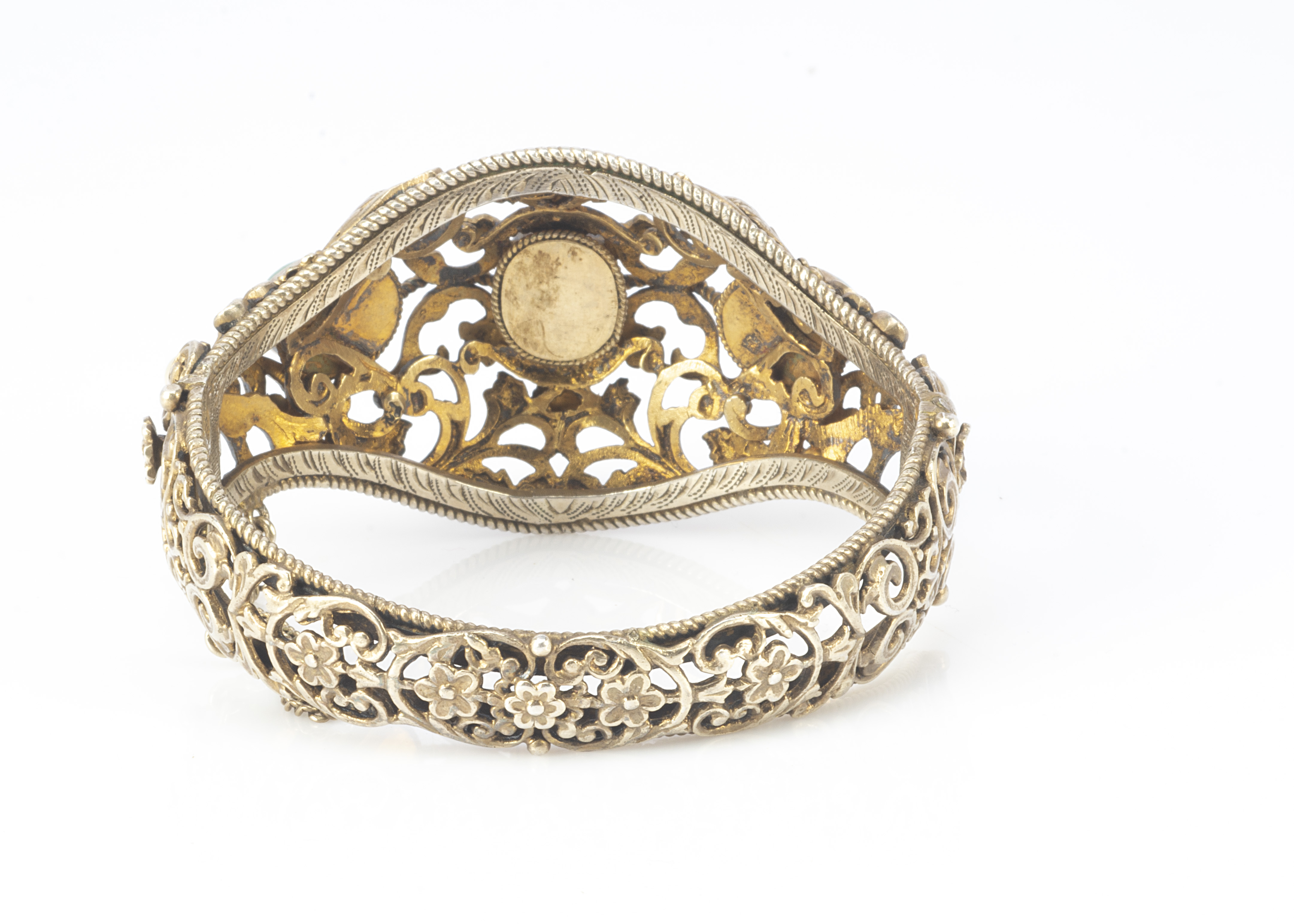 A 19th Century Austro Hungarian silver gilt pearl and green hardstone openwork bangle, with scroll - Image 2 of 2