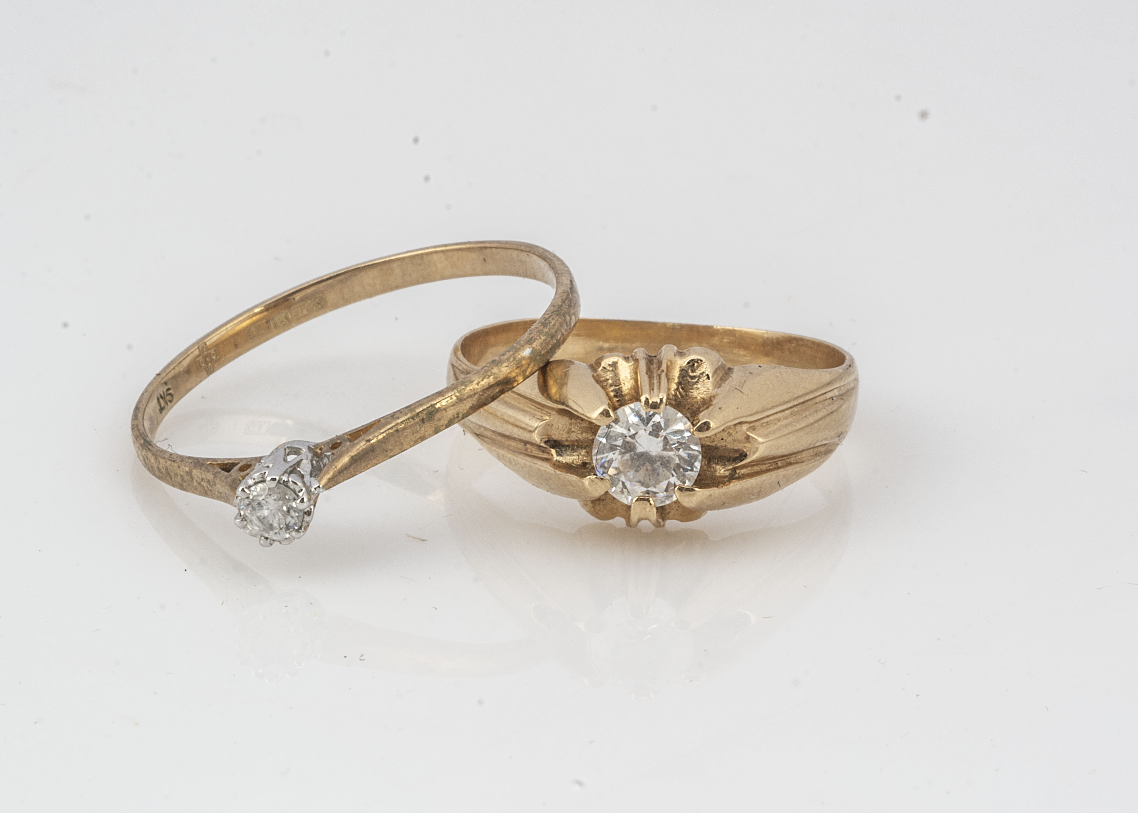 Two 9ct gold dress rings, including a paste set example, ring size R and a diamond solitaire, ring