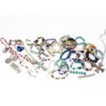 A collection of costume jewellery, including end of day glass beads, various gilt bracelets,