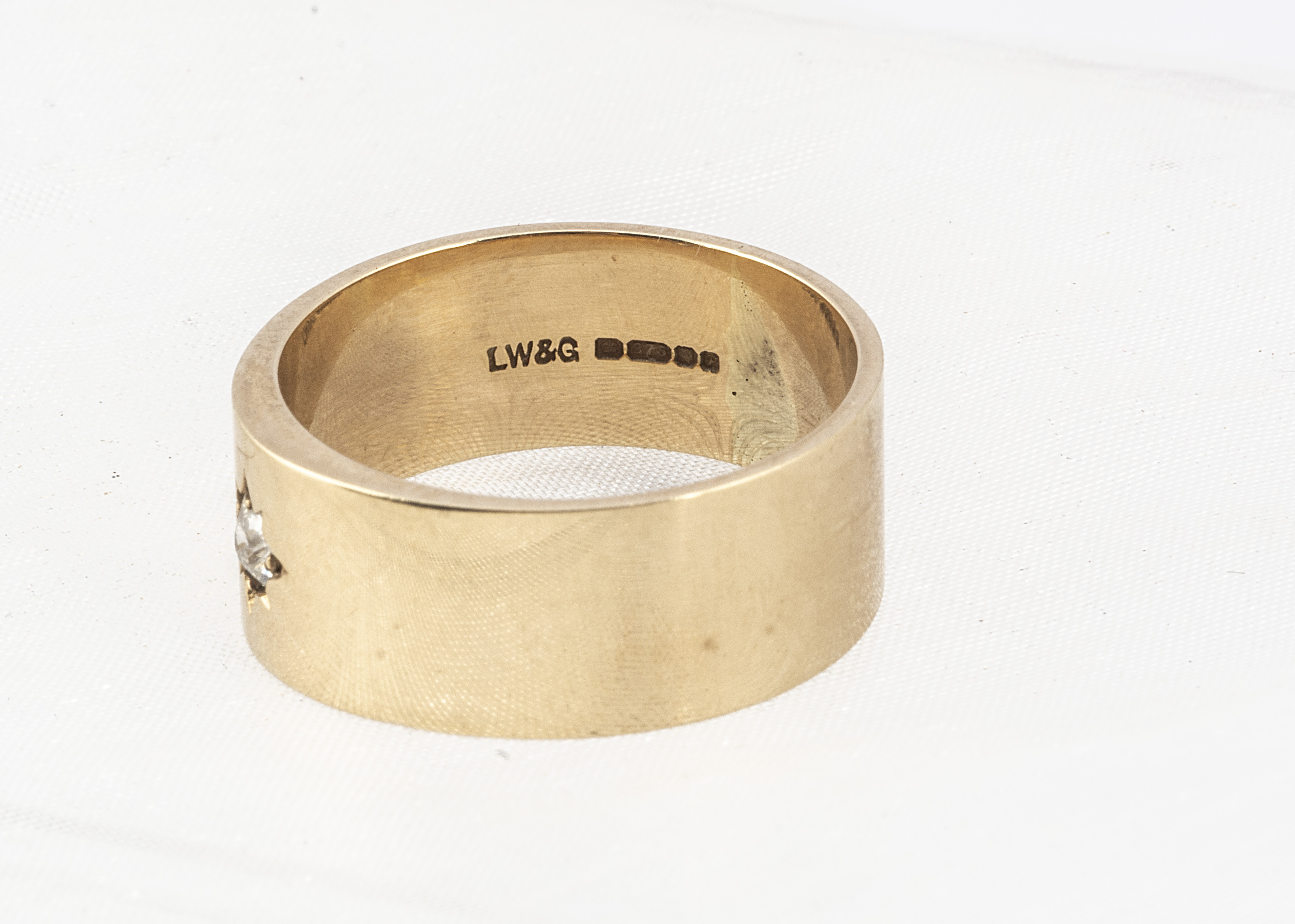 A 9ct gold diamond wedding band, with gypsy set old cut diamond of flattened form, 9mm wide, ring - Image 2 of 2