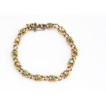 A 15ct gold turquoise and seed pearl bracelet, oval shaped links alternately set with turquoise