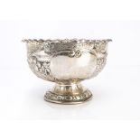 A Victorian silver footed bowl, 18cm diameter and 11.5cm high, with embossed decoration and engraved
