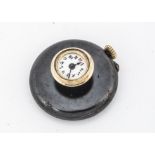 An early 20th century gun metal lapel watch, 29mm diameter, with raised dial in gold surround,