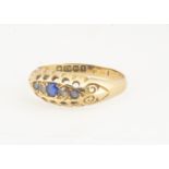 A Victorian 18ct gold sapphire and diamond chip set ring, ring size M, Birmingham 1898, 2g in a