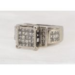 A contemporary 14ct diamond dress ring, with square tablet raised top, scroll shoulders, pave set