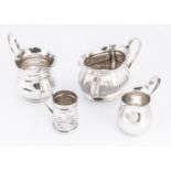 Four Victorian and later small items of silver, including three jugs and a miniature tankard, 6.8