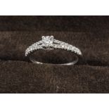 A certificated 'Tolkowsky' diamond solitaire dress ring, the 18ct white gold ring set with central
