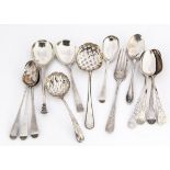 A collection of Georgian and later silver spoons, including two sifter spoons, bright cut teaspoons,