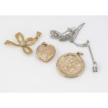 A small quantity of gold pendants, including a St Christopher, a heart shaped locket, small