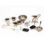 A collection of Georgian and later silver items, including a cream jug, a bowl on three supports,