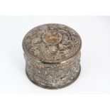 A vintage Chinese circular box by Luenwo, 10cm diameter, 7.87 ozt, with raised floral decoration