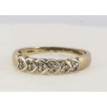 A 9ct gold diamond dress ring, small brilliants set threes, ring size S, 0.25cts 2.5g