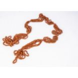 A 19th Century Italian coral multi strand necklace, each interlocking carved strand in short