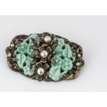 An Art Deco simulated jade, pearl and base metal brooch, of oval design with moulded plastic