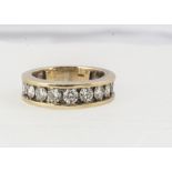 An 18ct gold three quarter diamond eternity ring, channel set brilliant cuts in yellow gold, ring