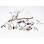 A quantity of silver jewellery, including bangles, oval lockets, rings, silver gilt rope twist