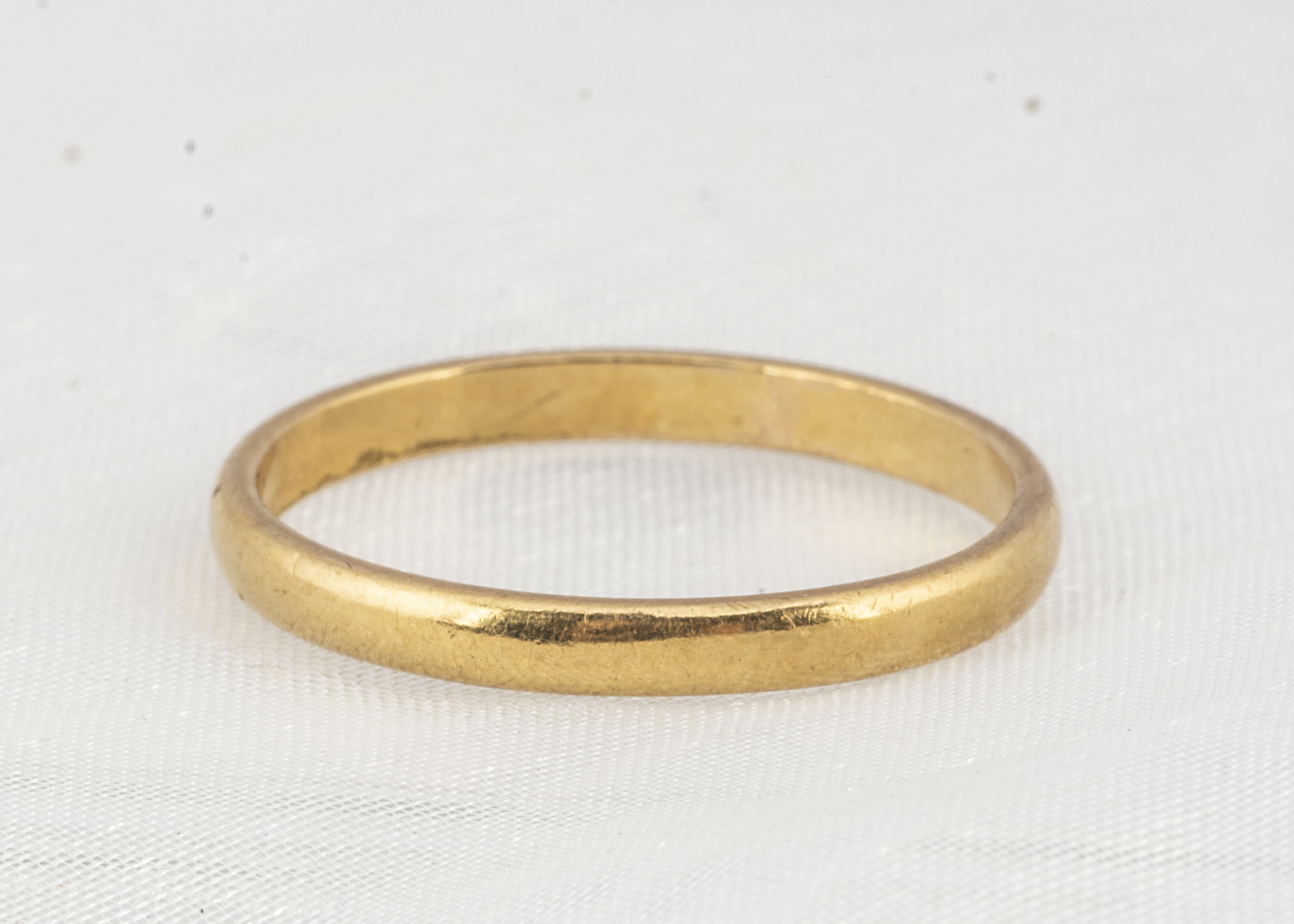 A 22ct gold wedding band, D shaped, ring size M, 2mm wide, 2.1g