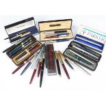 A collection of Parker fountain pens and other pens, including two Parker 17 fountain pens,