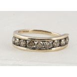 A continental diamond nine stone dress ring, the channel set brilliant cuts, in yellow metal, ring