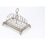 A William IV silver toast rack by Henry Holland, 20.5cm wide and 14.5 ozt, London 1834, seven