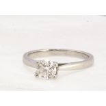 A platinum and diamond solitaire ring, the brilliant cut in four claw setting, diamond 0.56ct,