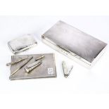 An Art Deco period silver cigarette case and box and other items, including a rectangular box, 17.