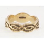 A 9ct gold knot signet ring, the intertwined shank having oval plain tablet top, ring size U, 4.9g