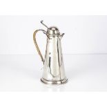 An Arts & Crafts period silver hot water jug by Frank Rowland Snow & Robert Ashworth, 24.5cm